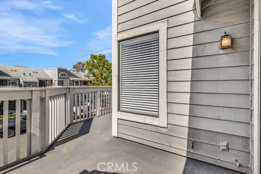 49 Remington Irvine, CA 92620 - Photo 20 of 26 a view of a balcony with a couple of cars parked in front of house