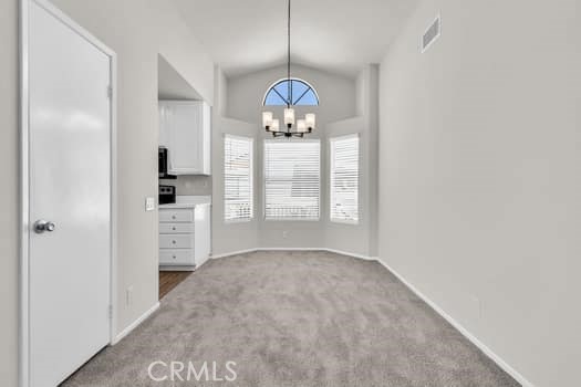 49 Remington Irvine, CA 92620 - Photo 5 of 26 a view of an empty room with window and cabinet area
