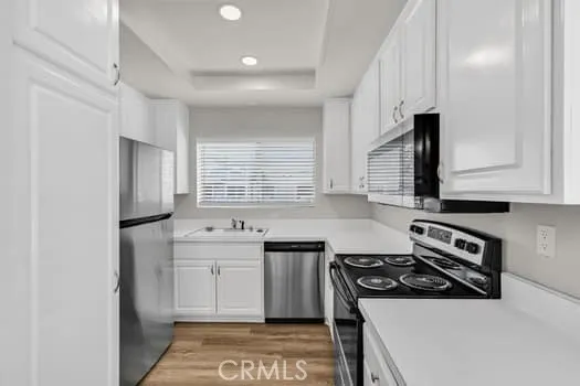 a kitchen with a stove and a sink