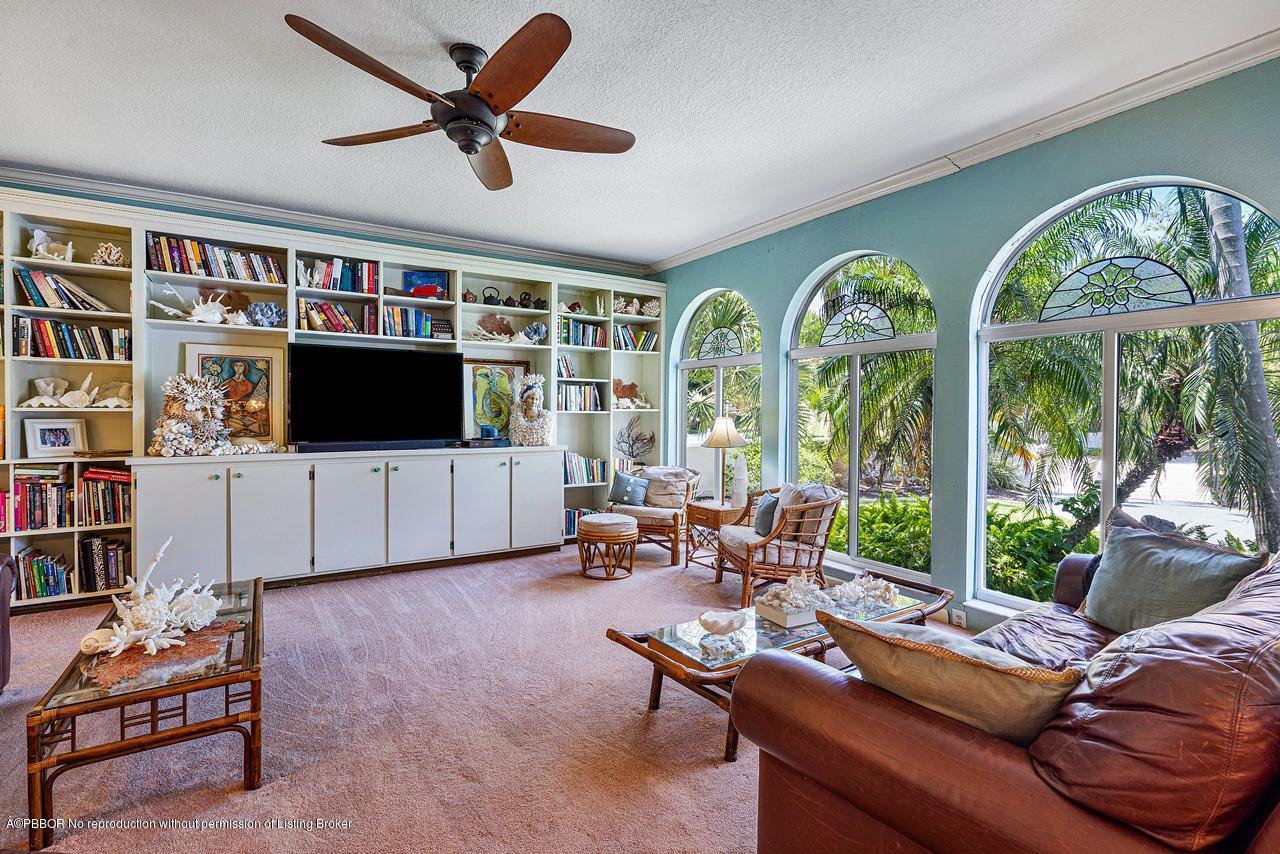 15 East Ocean Avenue Ocean Ridge, FL 33435 - Photo 16 of 31 a living room with furniture fireplace and flat screen tv
