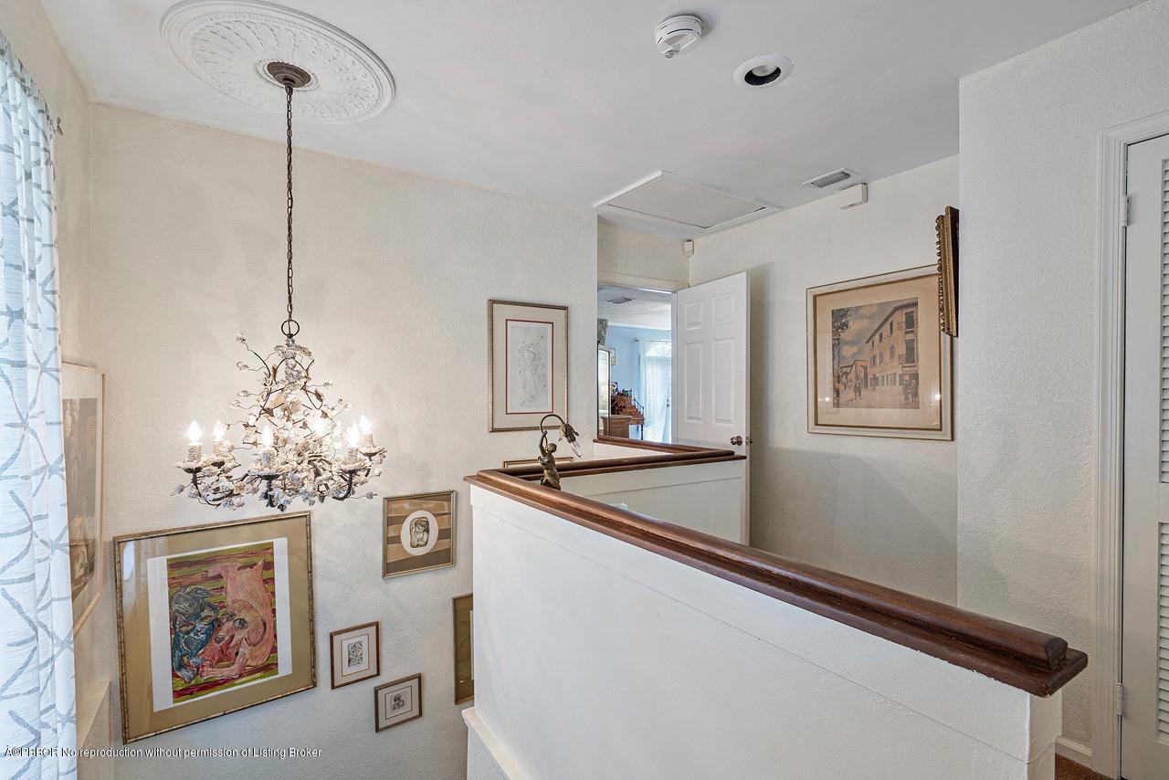 15 East Ocean Avenue Ocean Ridge, FL 33435 - Photo 17 of 31 a room with chandelier and furniture