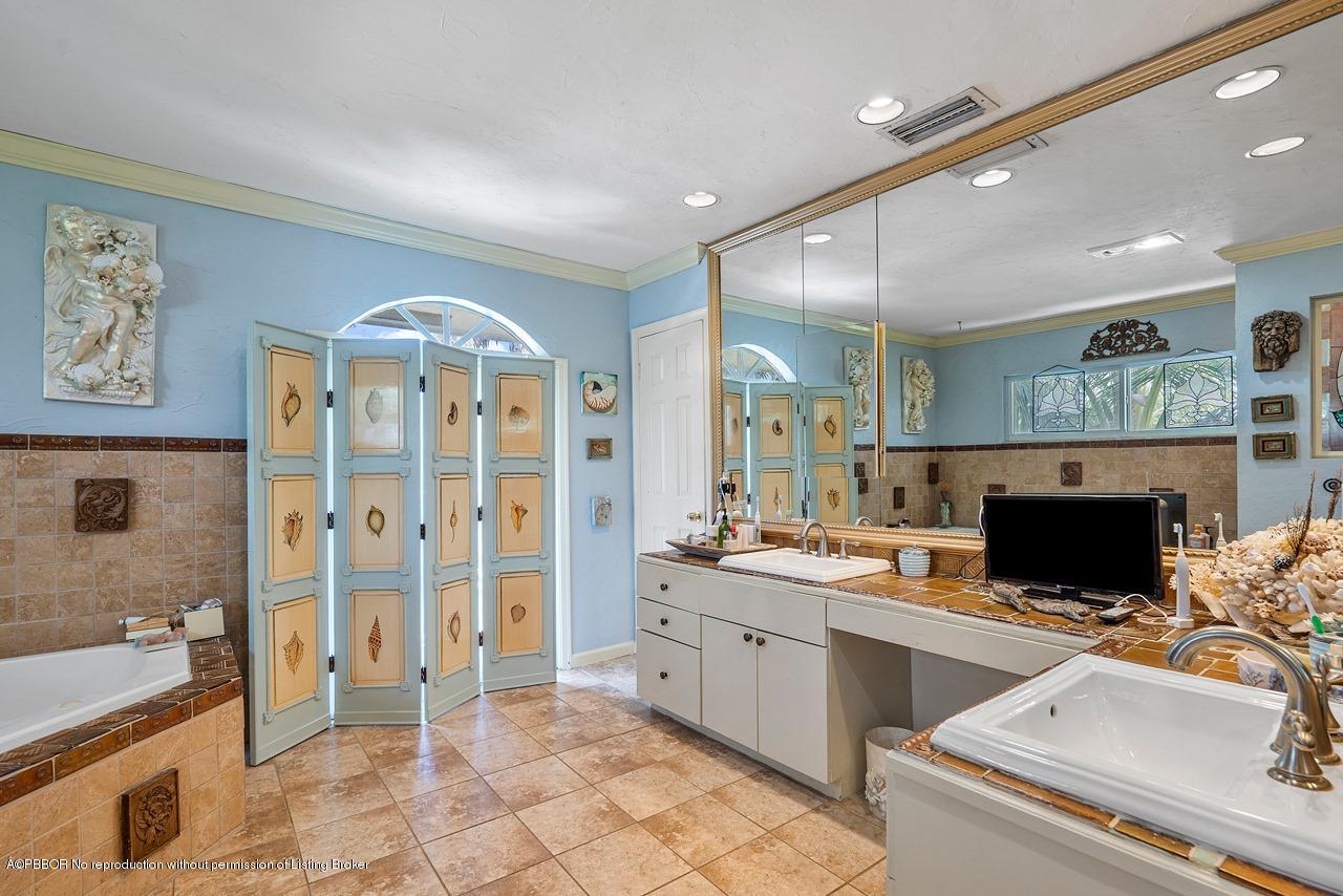 15 East Ocean Avenue Ocean Ridge, FL 33435 - Photo 19 of 31 a kitchen with a sink and a stove top oven