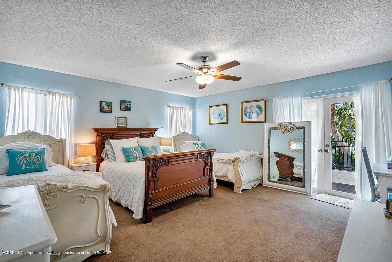 15 East Ocean Avenue Ocean Ridge, FL 33435 - Photo 20 of 31 a bed room with bed and window