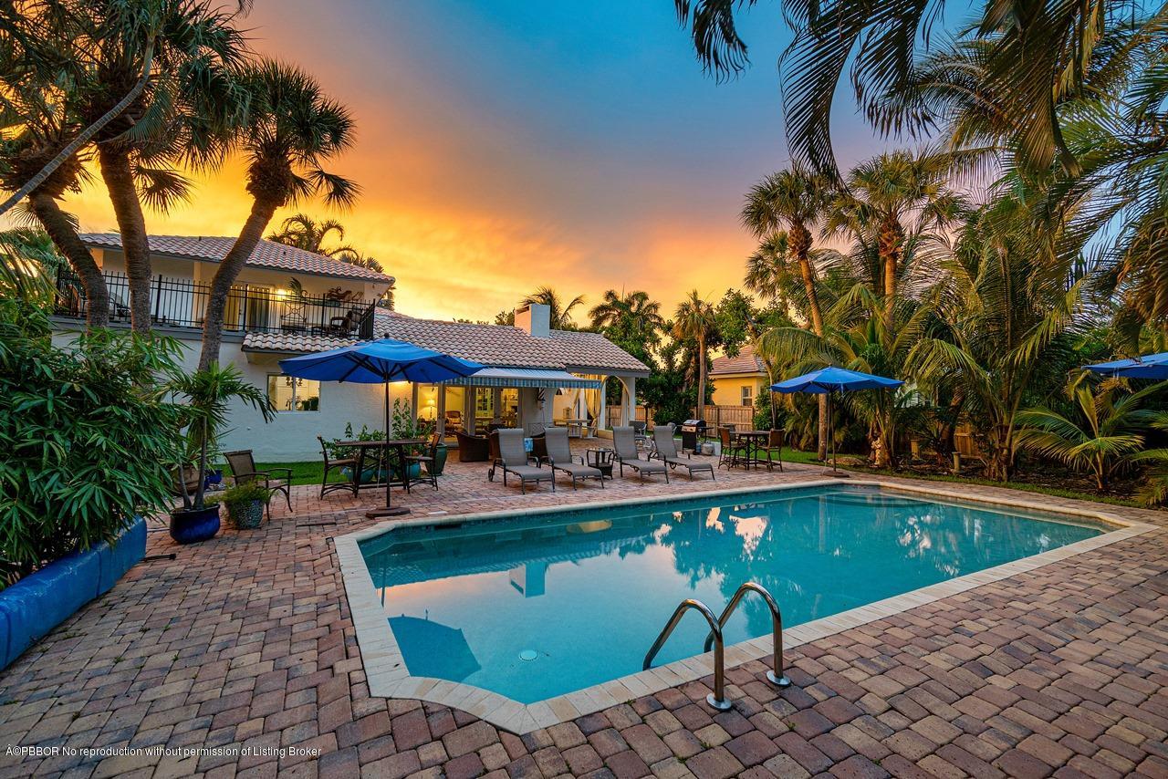 15 East Ocean Avenue Ocean Ridge, FL 33435 - Photo 3 of 31 a view of a patio with swimming pool table and chairs