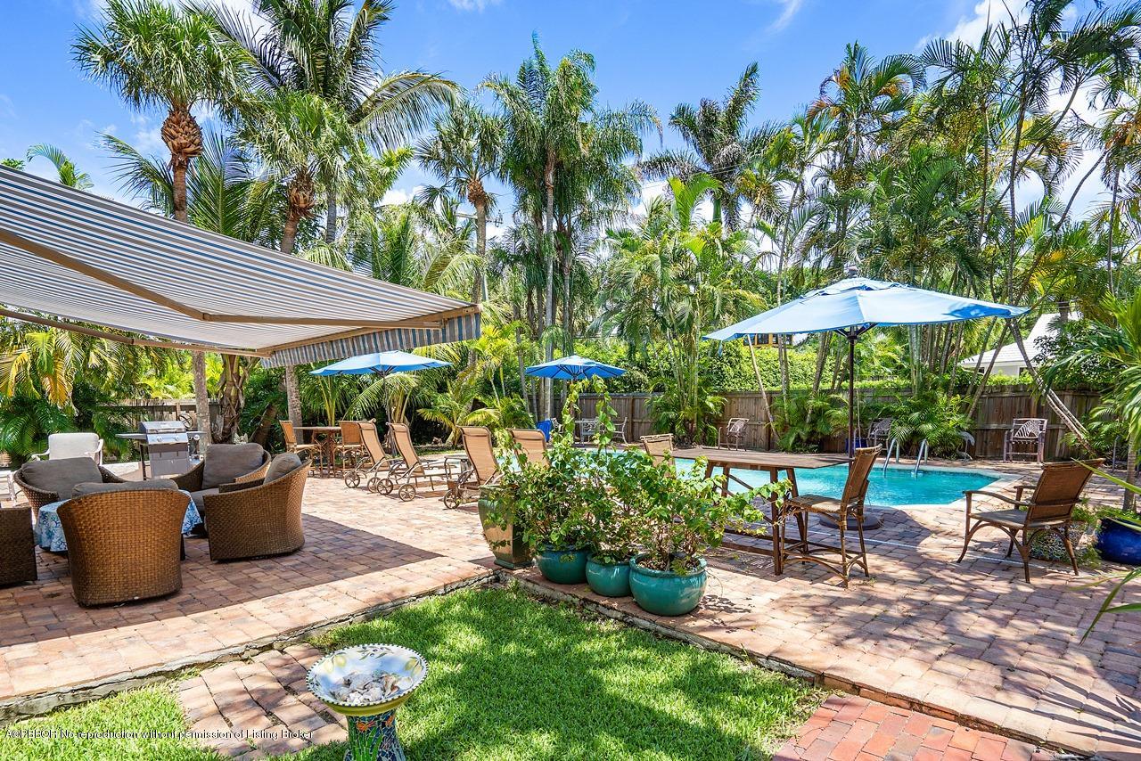 15 East Ocean Avenue Ocean Ridge, FL 33435 - Photo 22 of 31 a view of a patio with chairs and plants