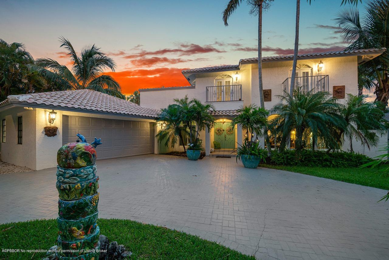 15 East Ocean Avenue Ocean Ridge, FL 33435 - Photo 30 of 31 a view of a house with a yard and potted plants