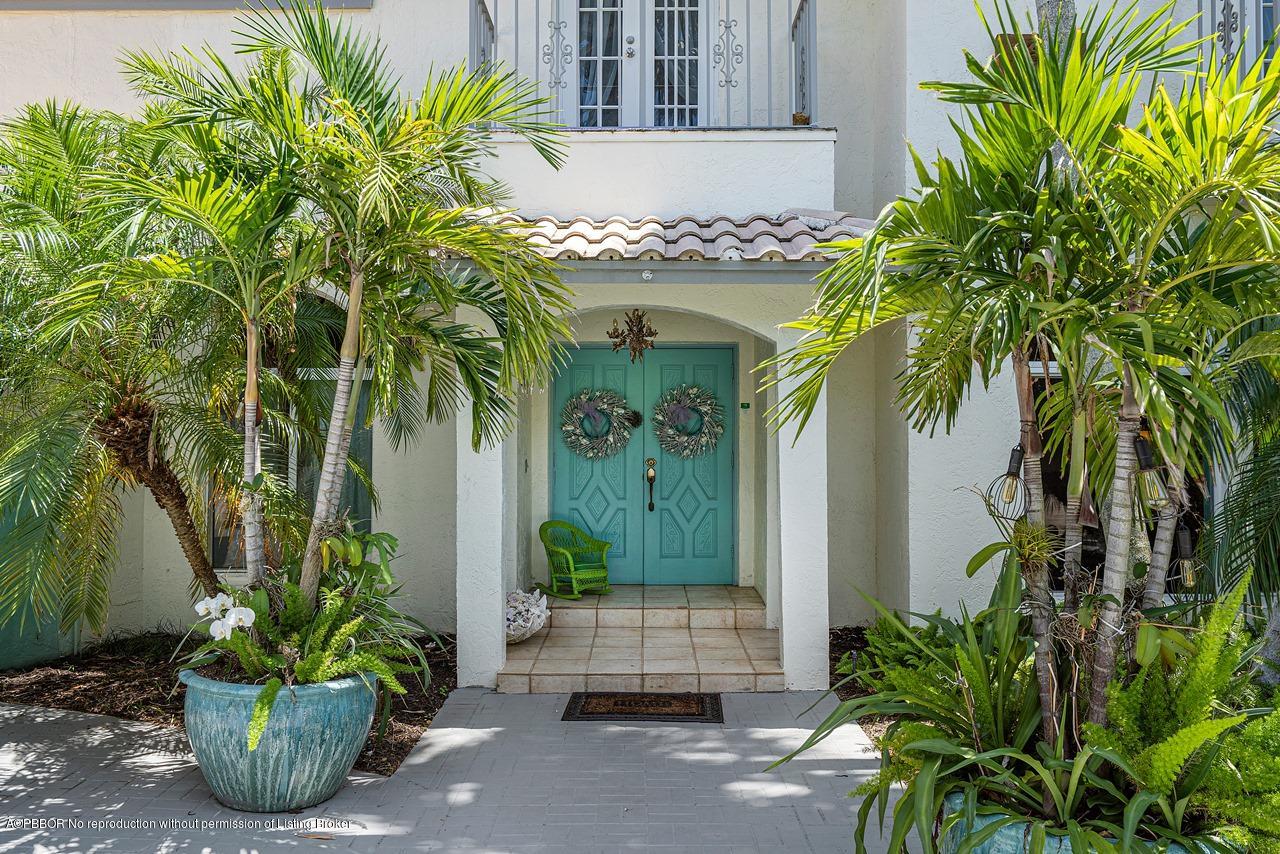 15 East Ocean Avenue Ocean Ridge, FL 33435 - Photo 7 of 31 a front view of a house with a garden