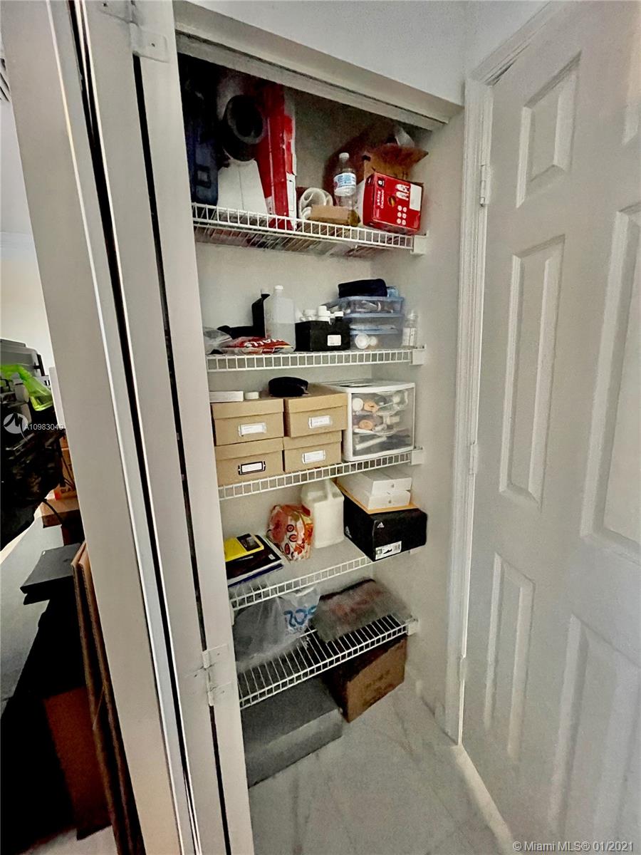 16237 Southwest 48th Street Miramar, FL 33027 - Photo 13 of 28 a room with storage and a sink