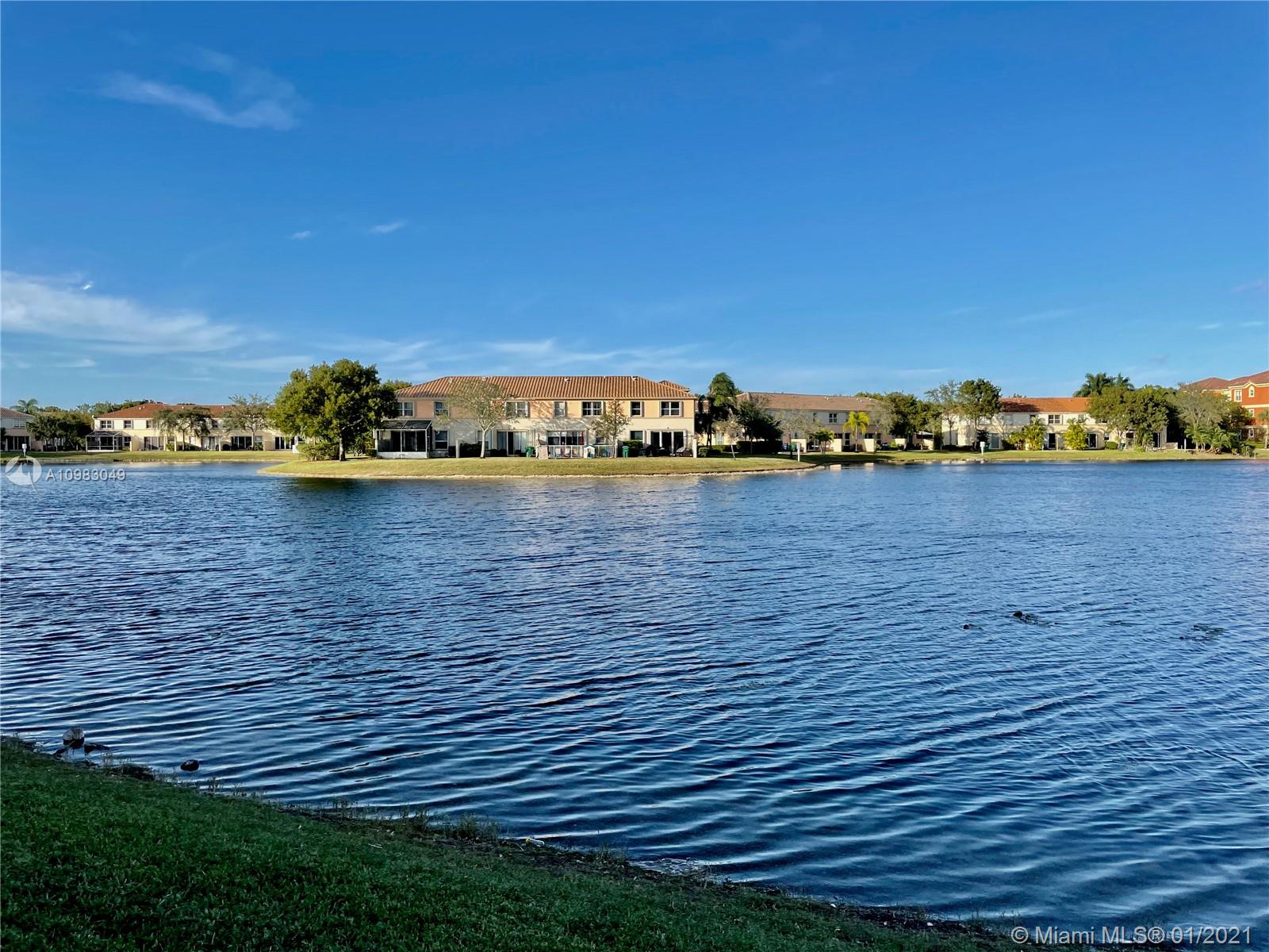 16237 Southwest 48th Street Miramar, FL 33027 - Photo 26 of 28 a view of a houses with a yard and lake view