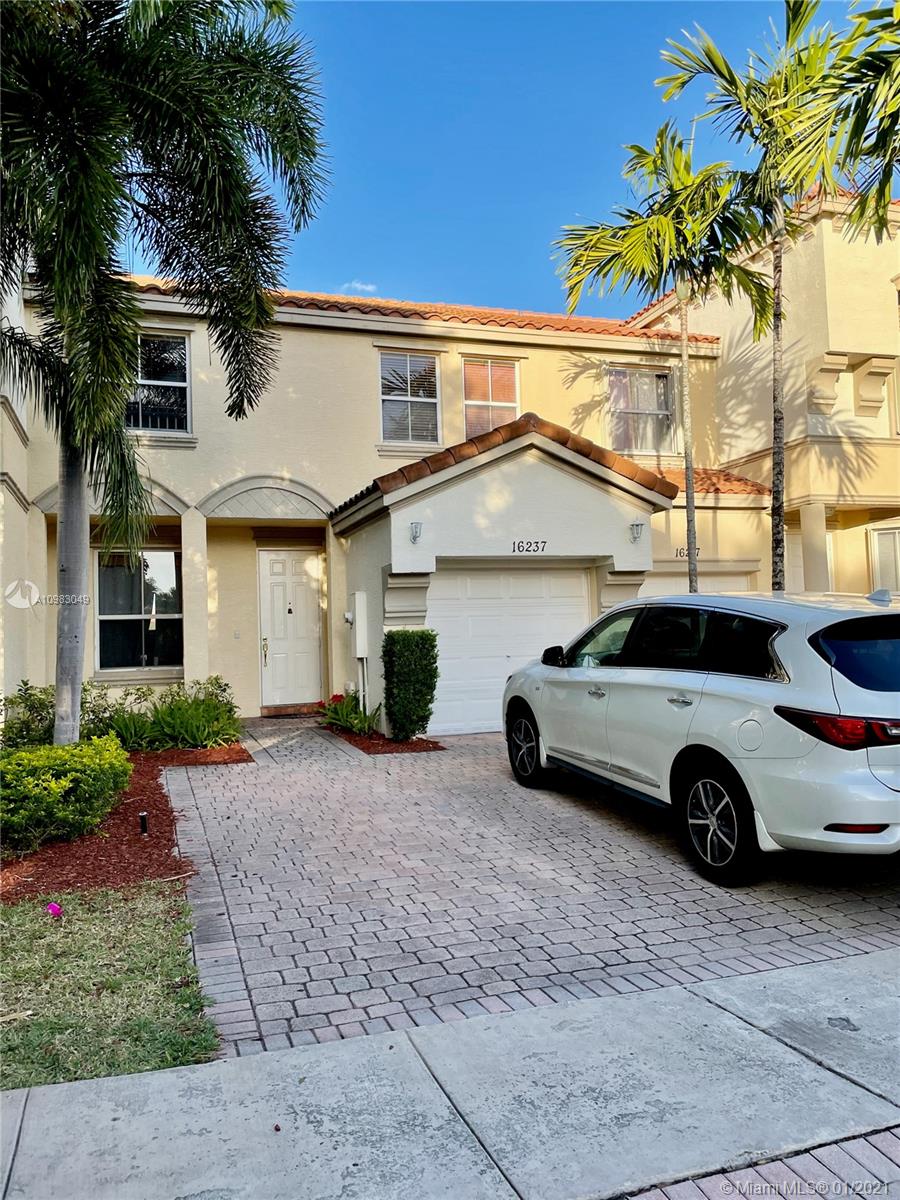 16237 Southwest 48th Street Miramar, FL 33027 - Photo 28 of 28 a car parked in front of a house