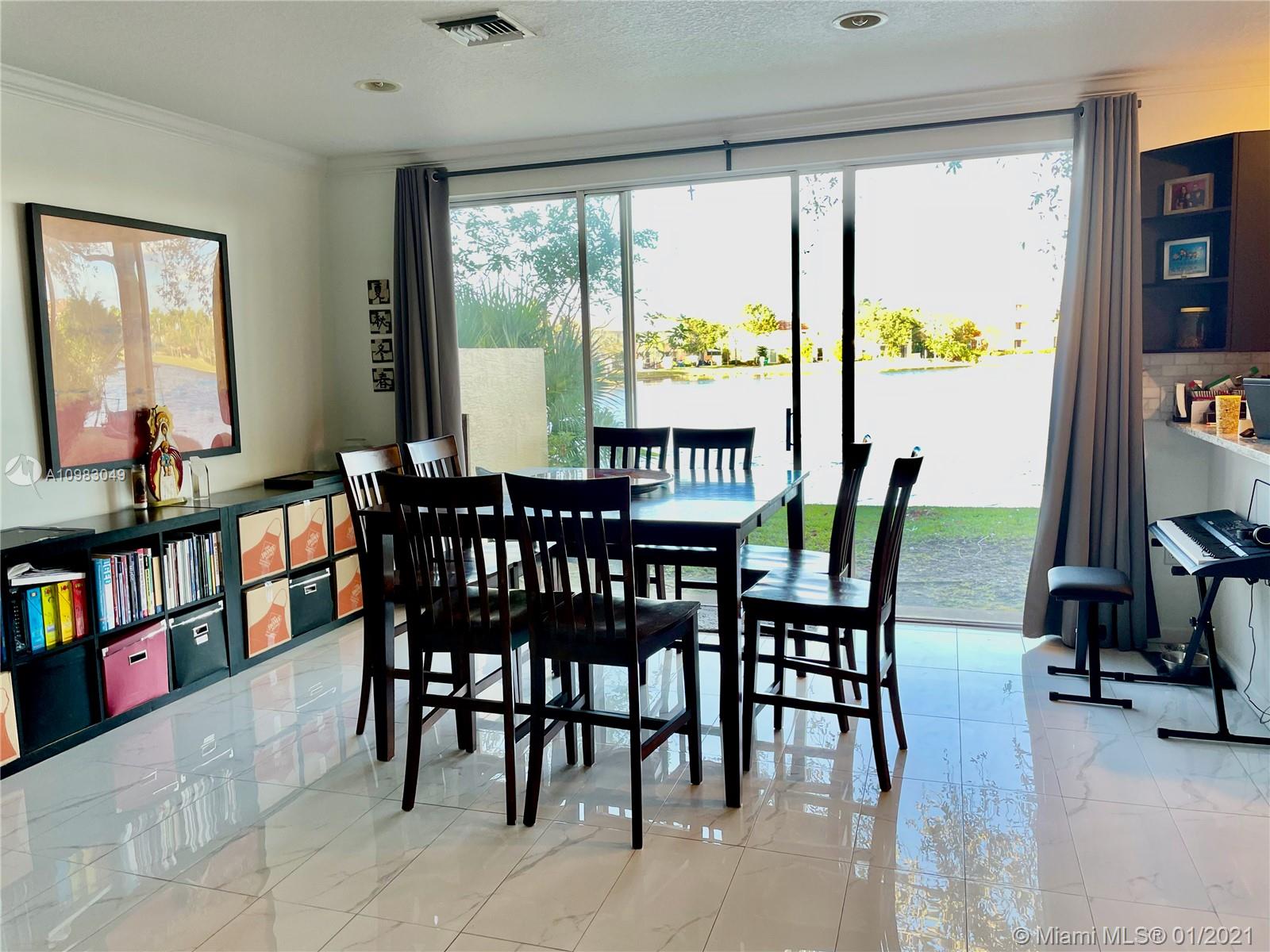 16237 Southwest 48th Street Miramar, FL 33027 - Photo 5 of 28 a view of a dining room with furniture window and outside view