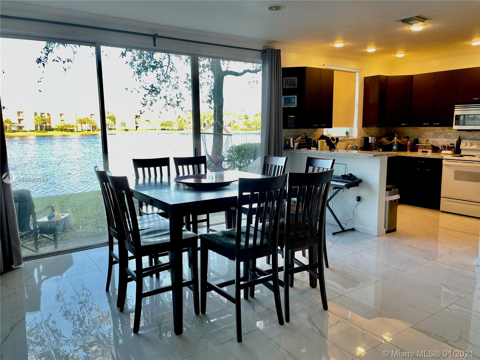 16237 Southwest 48th Street Miramar, FL 33027 - Photo 7 of 28 a view of a dining room with furniture window and outside view