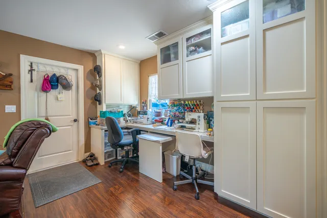 a spacious bathroom with a double vanity sink a large mirror and a shower