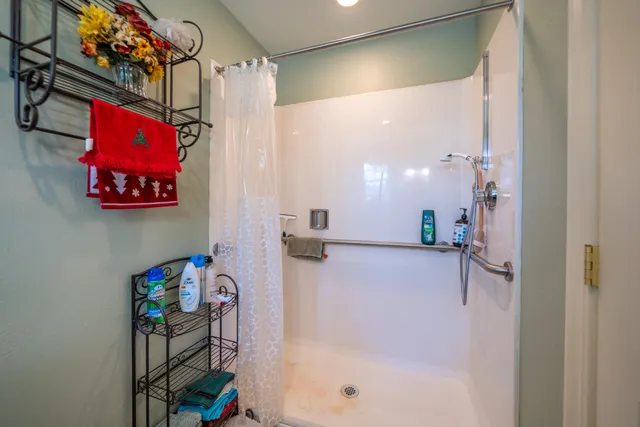 a bed room with a bed and a large window