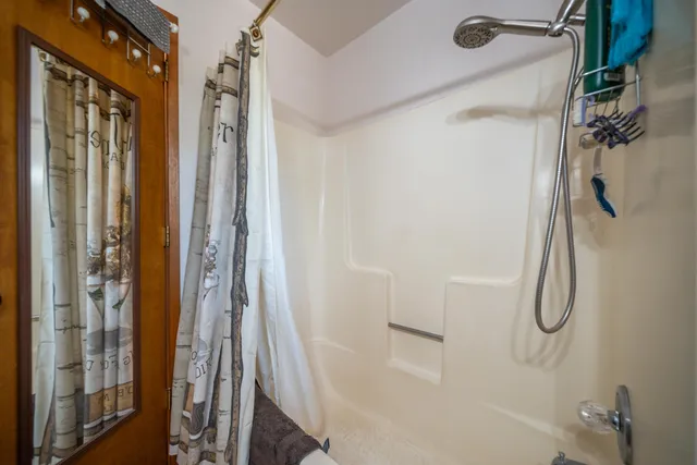 a view of house with backyard and garden