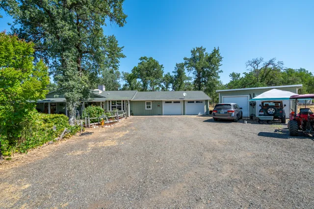 a view of garage with a car parked in it