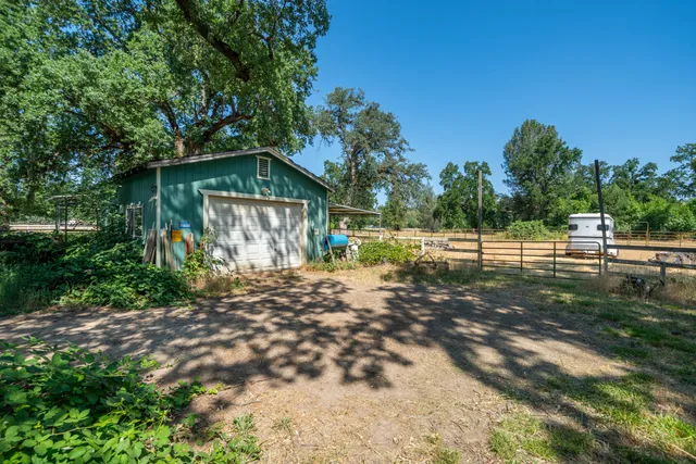 a backyard of a house with lots of green space
