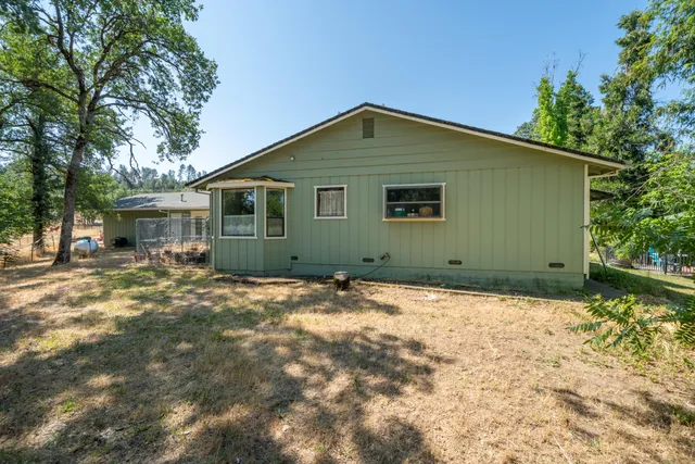 a backyard of a house with lots of green space