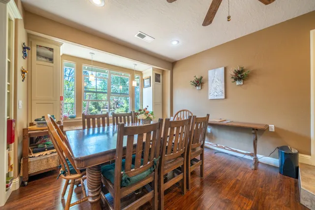 a kitchen with stainless steel appliances granite countertop a stove and a refrigerator