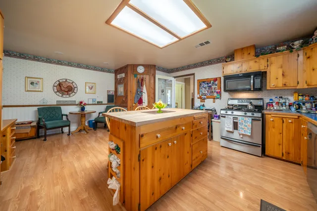 a view of a livingroom with furniture and a flat screen tv