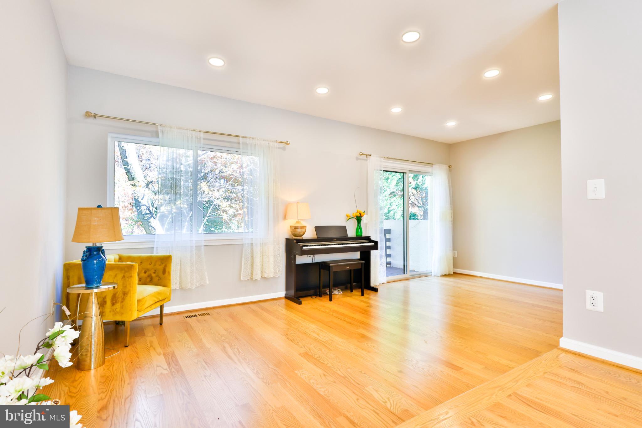 11817 Coopers Court Reston, VA 20191 - Photo 12 of 58 a living room with a stove and a table