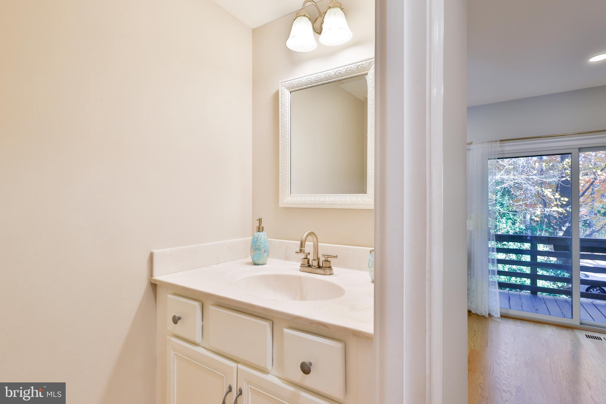 11817 Coopers Court Reston, VA 20191 - Photo 13 of 58 a bathroom with a sink vanity and a mirror