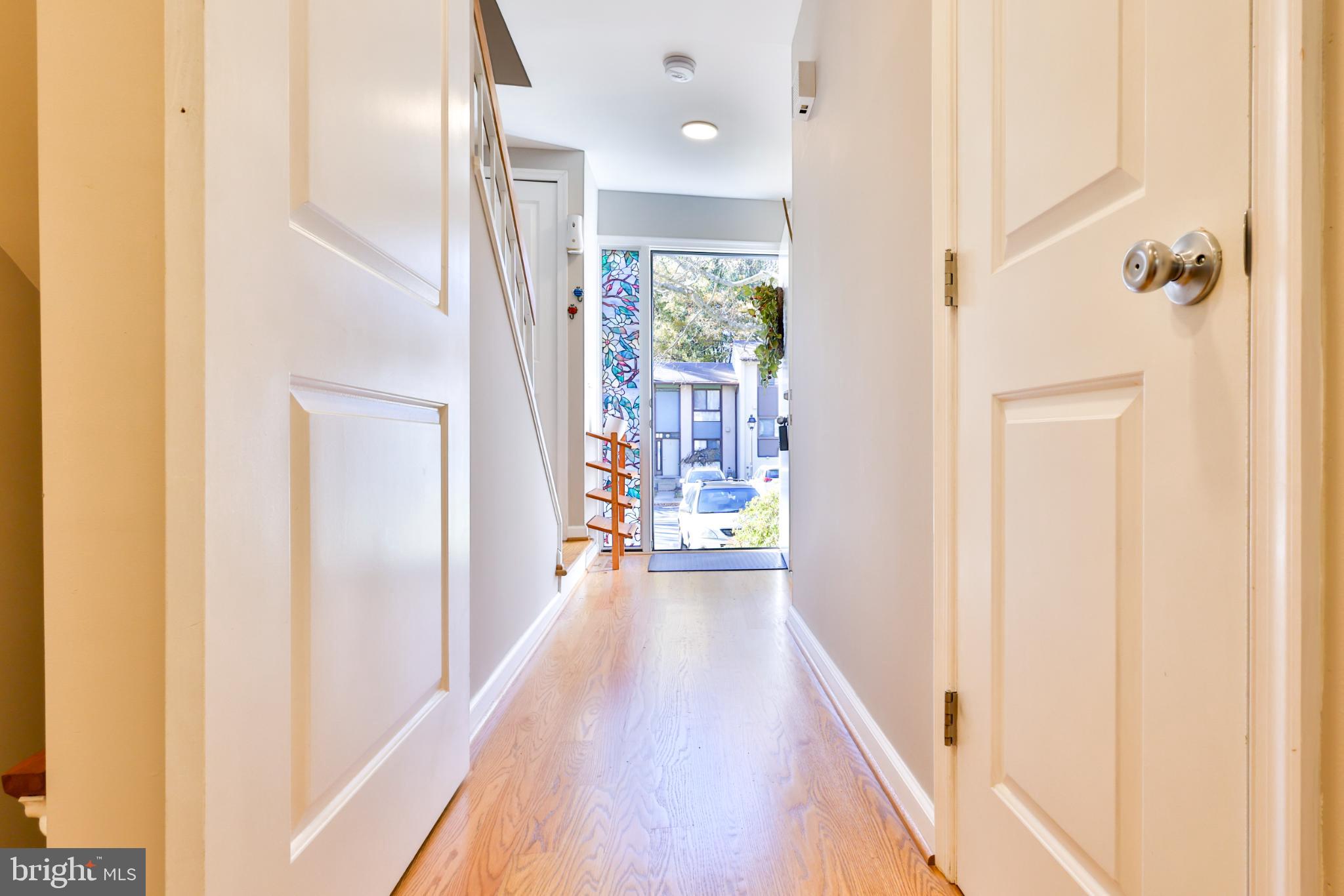 11817 Coopers Court Reston, VA 20191 - Photo 15 of 58 a view of a hallway with wooden floor and staircase
