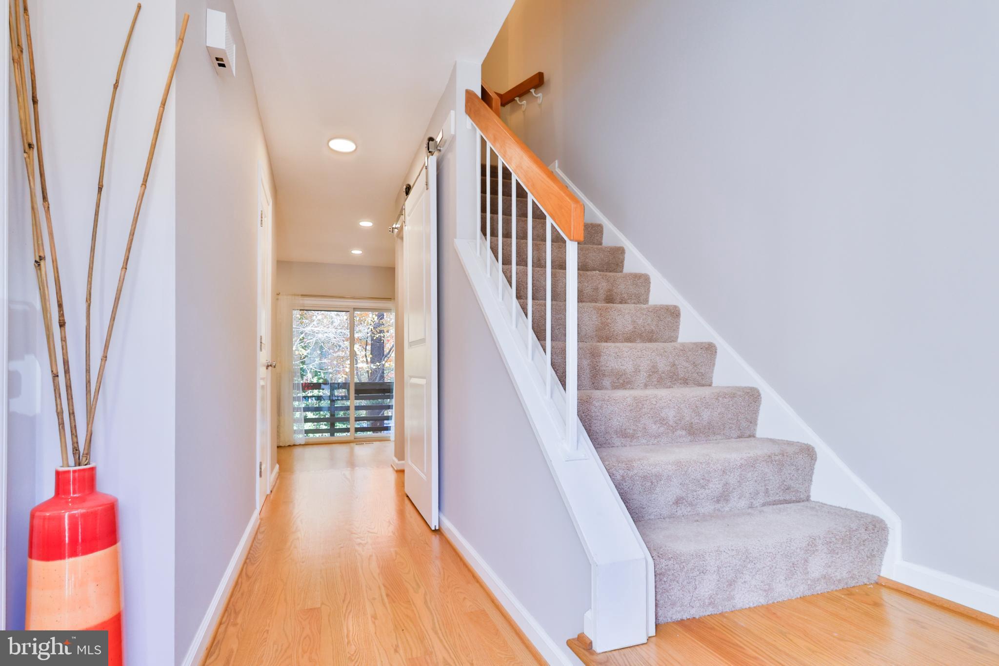 11817 Coopers Court Reston, VA 20191 - Photo 16 of 58 a view of entryway and hall with wooden floor