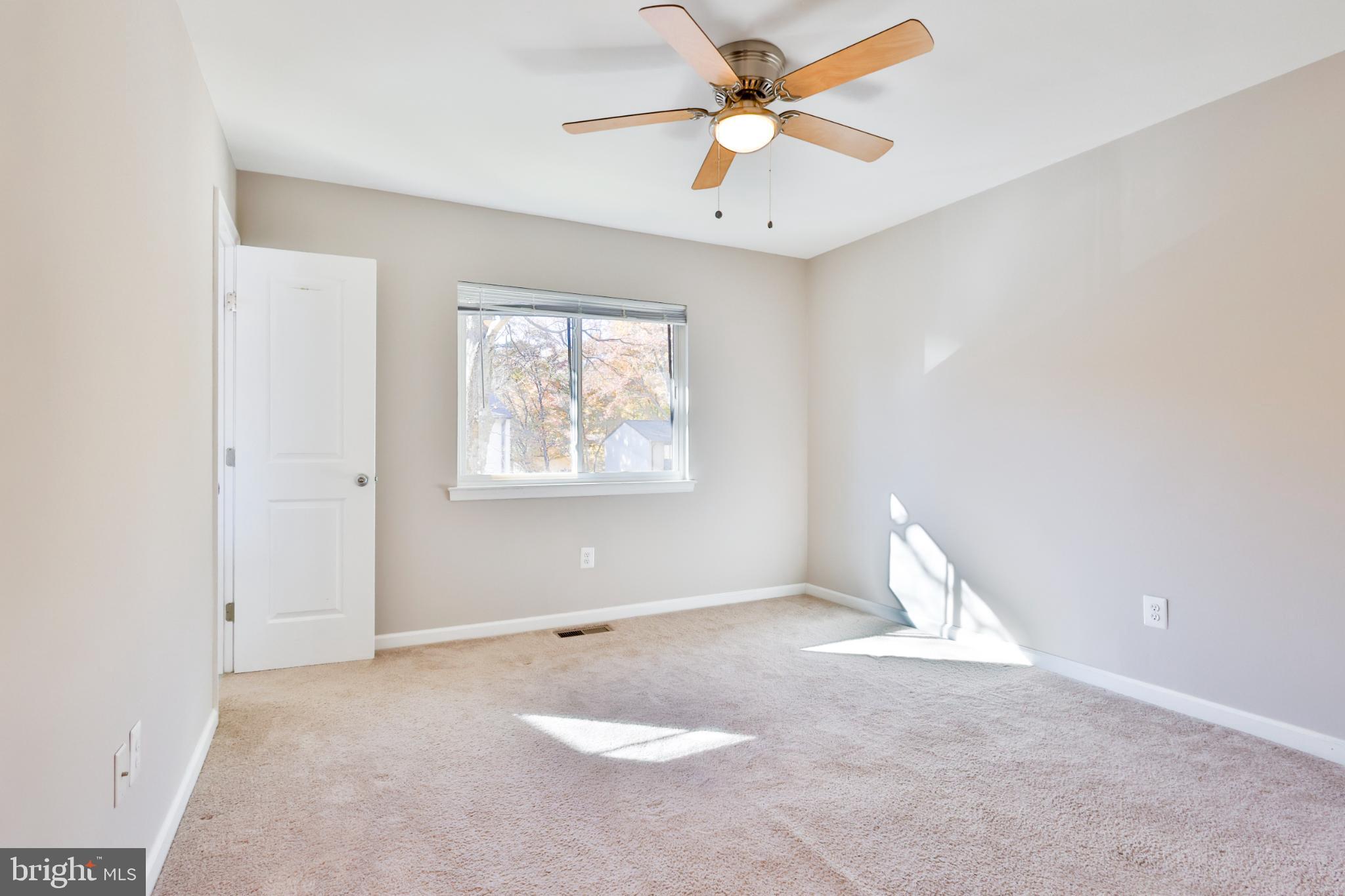 11817 Coopers Court Reston, VA 20191 - Photo 18 of 58 an empty room with a window and a fan
