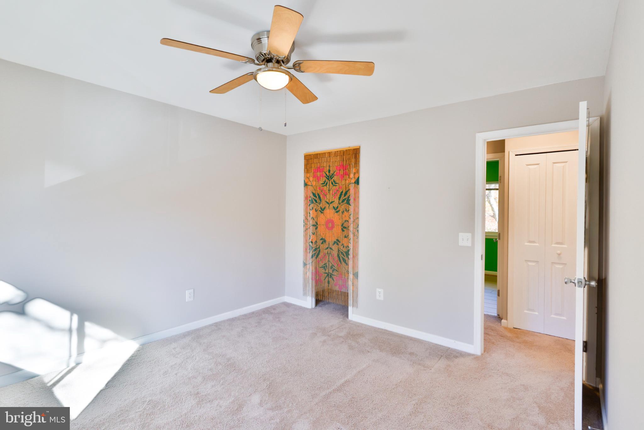 11817 Coopers Court Reston, VA 20191 - Photo 20 of 58 an empty room with closet and a chandelier fan