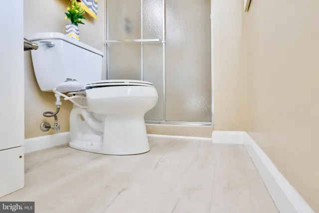 a room with a window and a chandelier