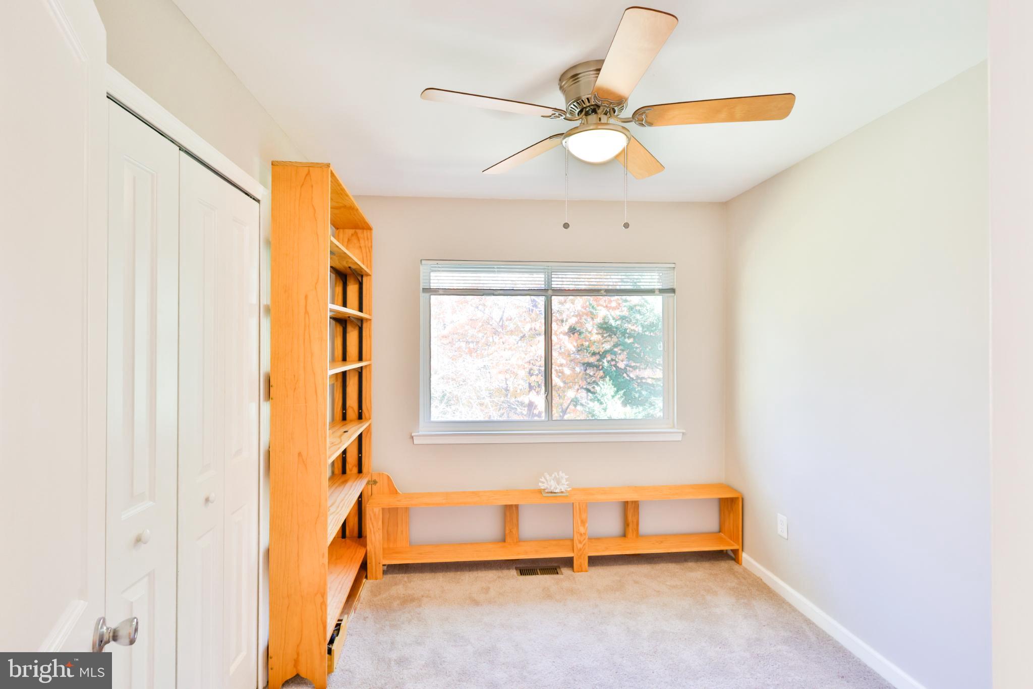 11817 Coopers Court Reston, VA 20191 - Photo 25 of 58 a room with a window and a chandelier