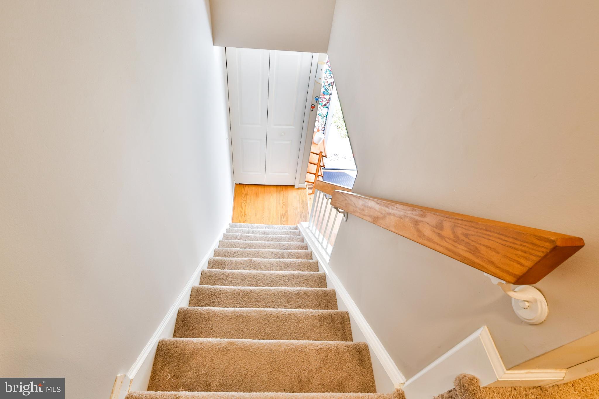 11817 Coopers Court Reston, VA 20191 - Photo 36 of 58 a view of staircase with white walls and a white door