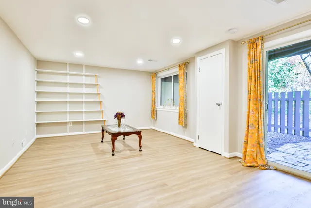 a view of a balcony with wooden floor