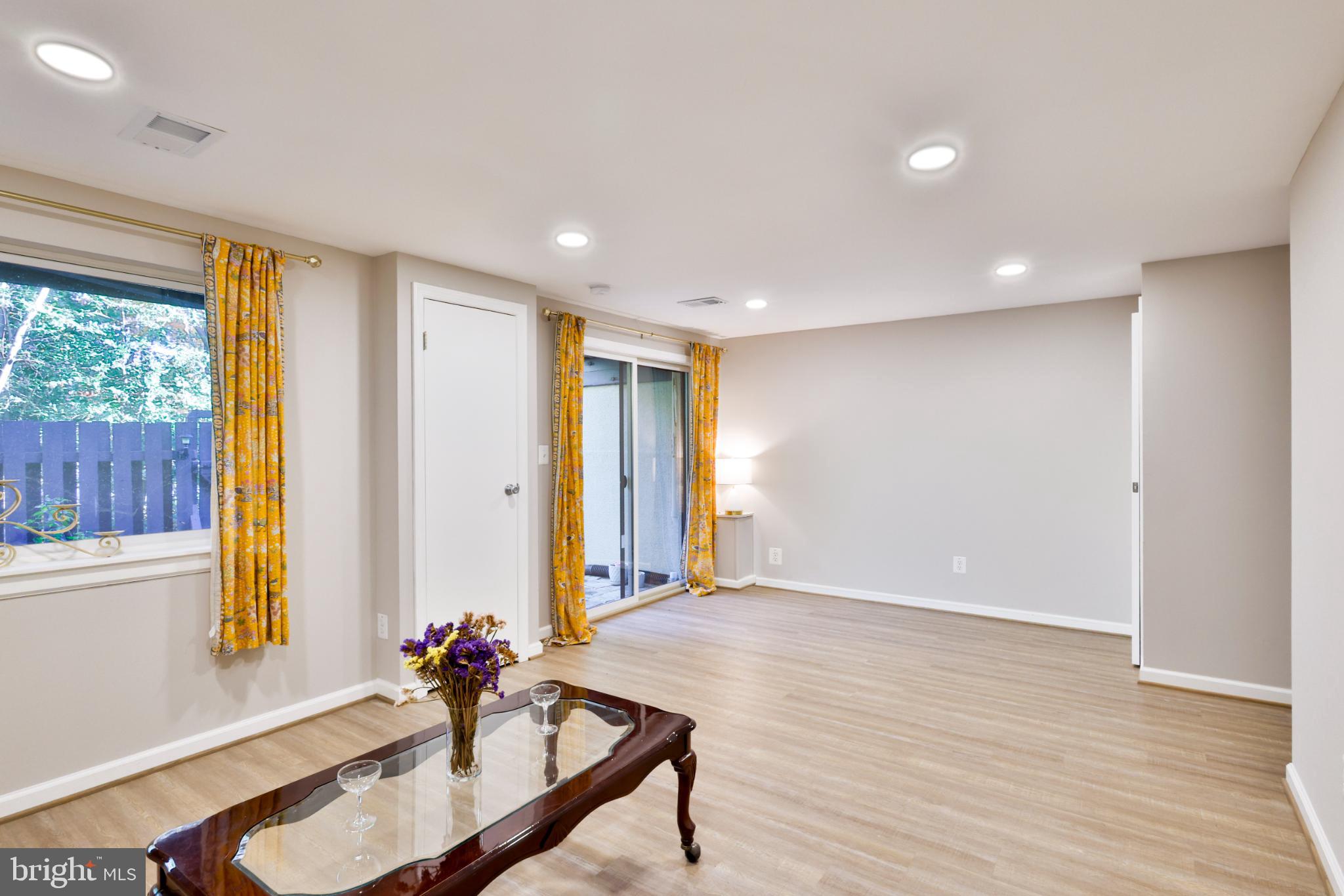11817 Coopers Court Reston, VA 20191 - Photo 41 of 58 a room with wooden floor and windows