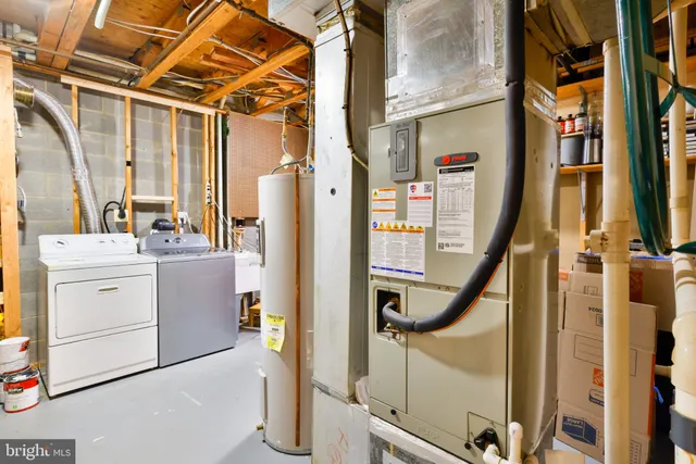 a view of a house with wooden fence