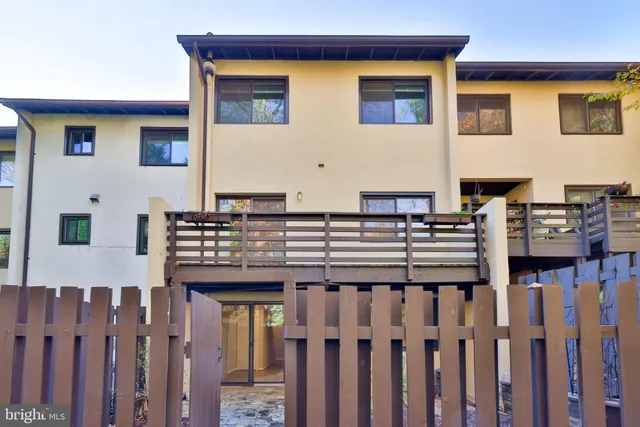 a blue sign that is sitting on a rock