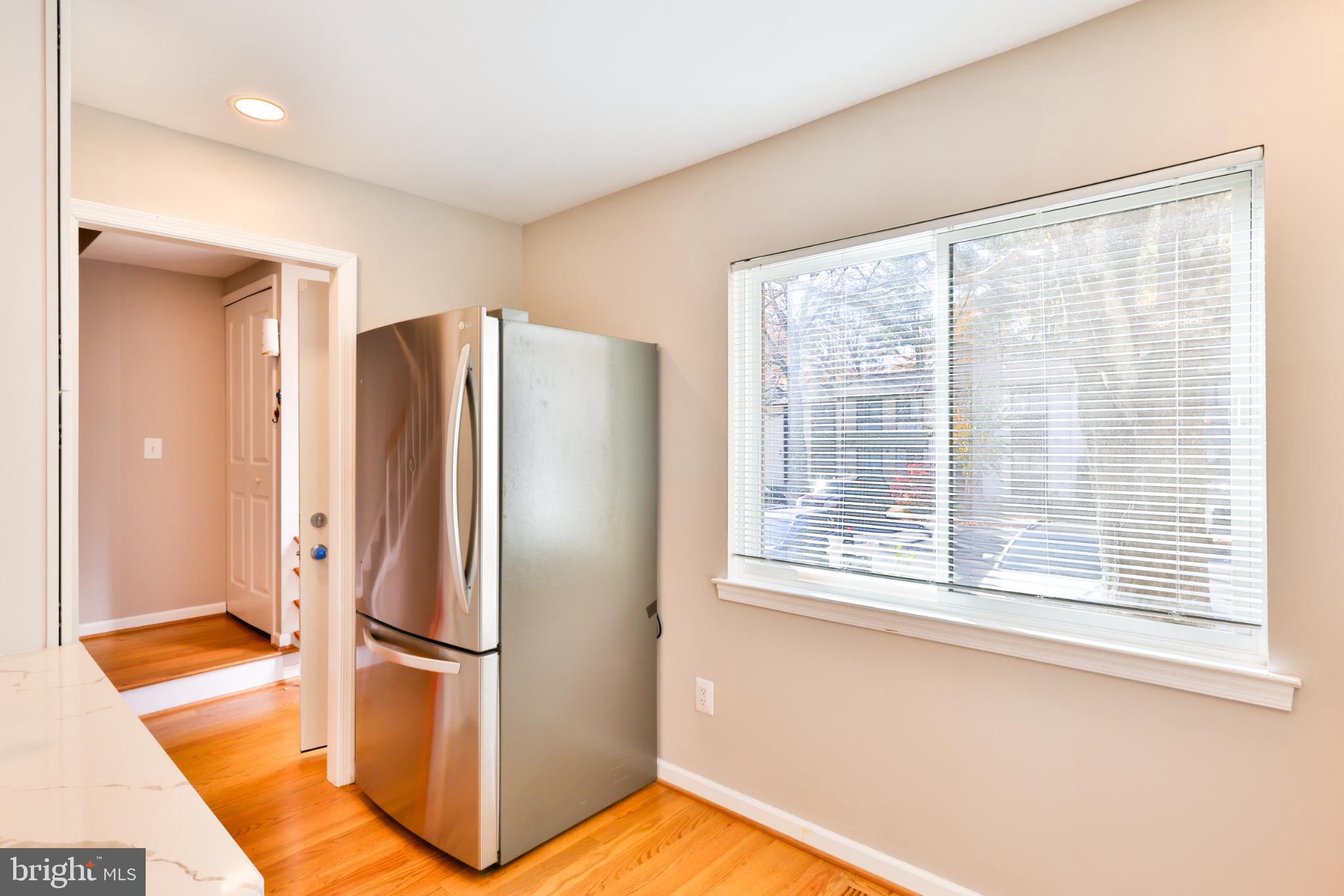 11817 Coopers Court Reston, VA 20191 - Photo 5 of 58 a view of a kitchen with a refrigerator and window