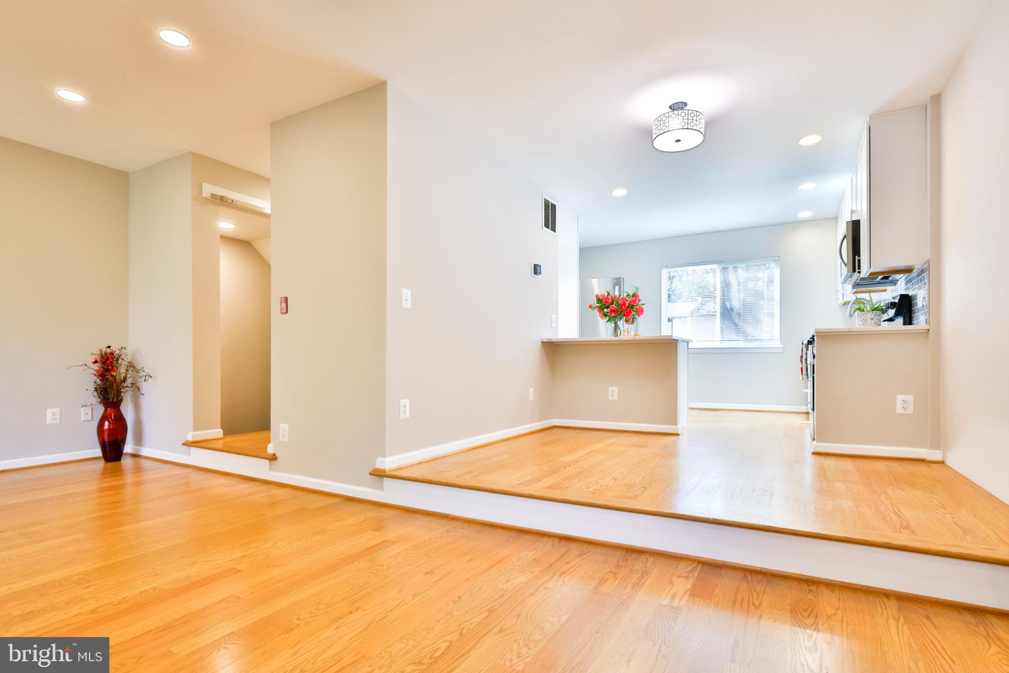 11817 Coopers Court Reston, VA 20191 - Photo 8 of 58 a view of a living room and a kitchen with a sink