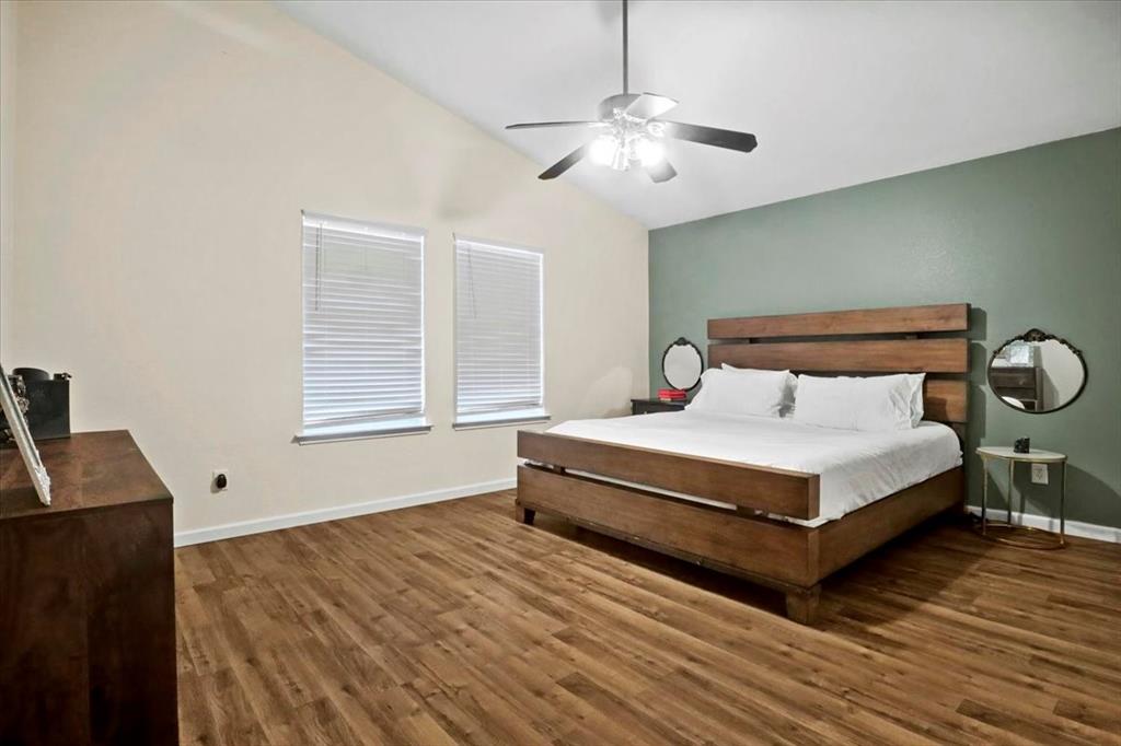 1412 Cheyenne Road Wylie, TX 75098 - Photo 18 of 24 Bedroom with vaulted ceiling, dark wood-style flooring, and ceiling fan