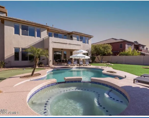 a view of a house with backyard porch and patio