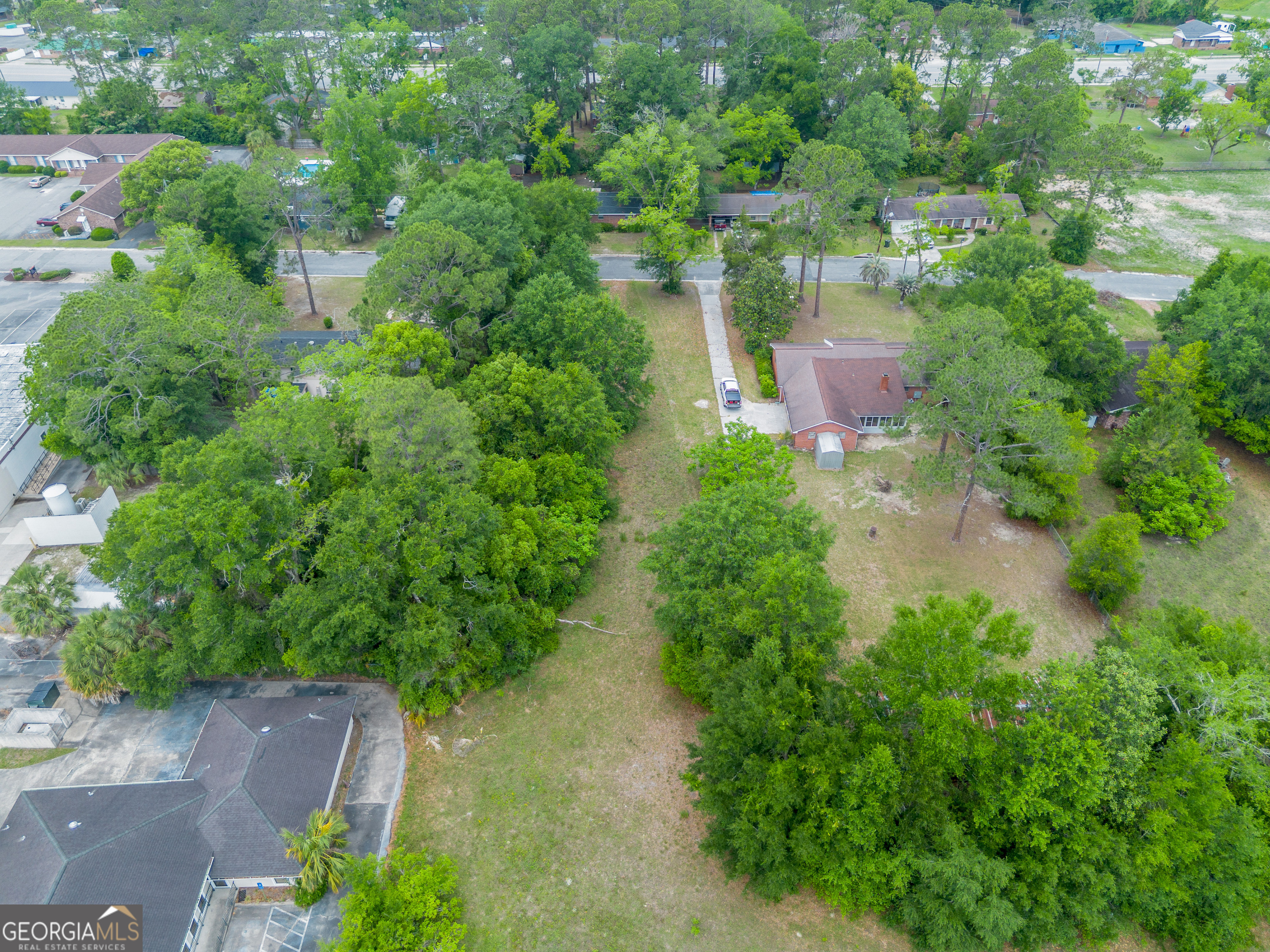 2011 Alice Street Waycross, GA 31501 - Photo 7 of 12 an aerial view of residential house with outdoor space and trees all around