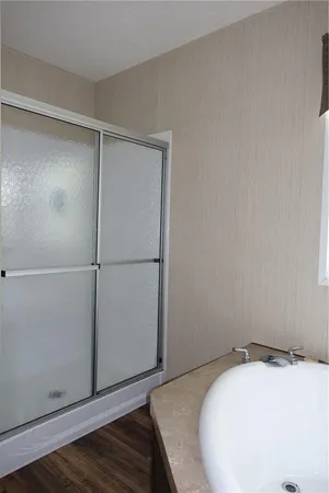a bathroom with a sink a toilet and a window
