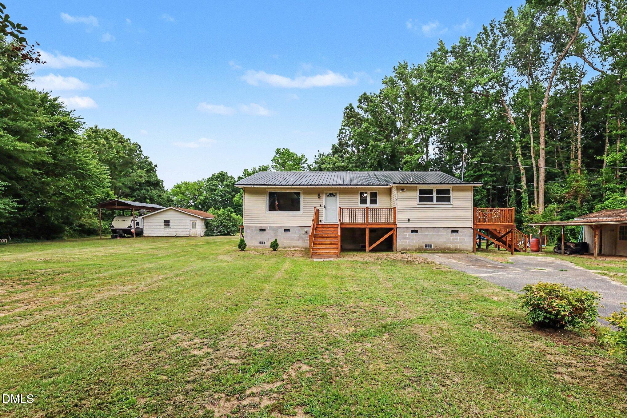 977 Stevens Mill Road Goldsboro, NC 27530 - Photo 1 of 31 a front view of house with yard and trees