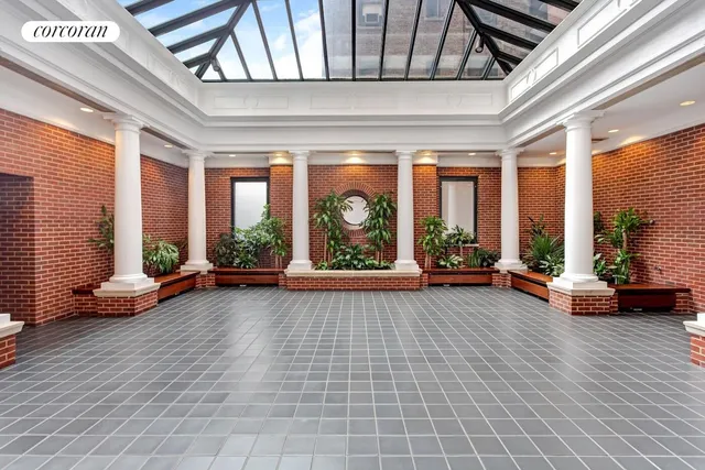 a view of room with furniture and floor to ceiling window