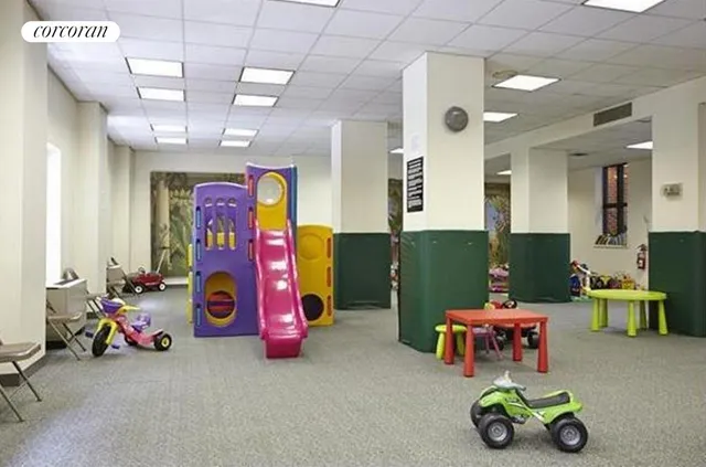 a play room with furniture and a table