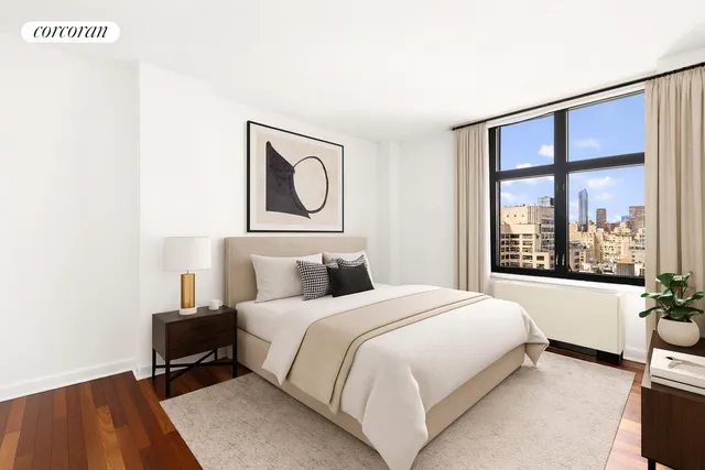 a bedroom with a bed and a large window