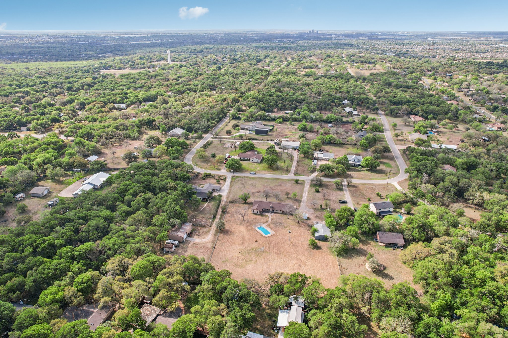 504 Buckaroo Trail Buda, TX 78610 - Photo 32 of 39 Drone / aerial view of a forest
