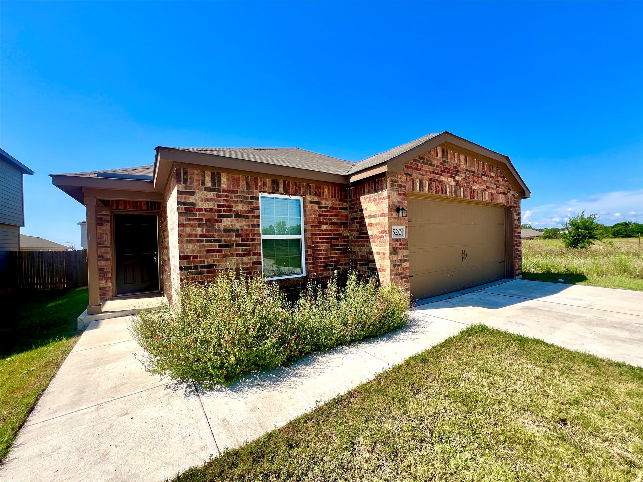520 Locksley Cove Jarrell, TX 76537 - Photo 2 of 27 A classic brick exterior and welcoming entrance define this charming single-story home.