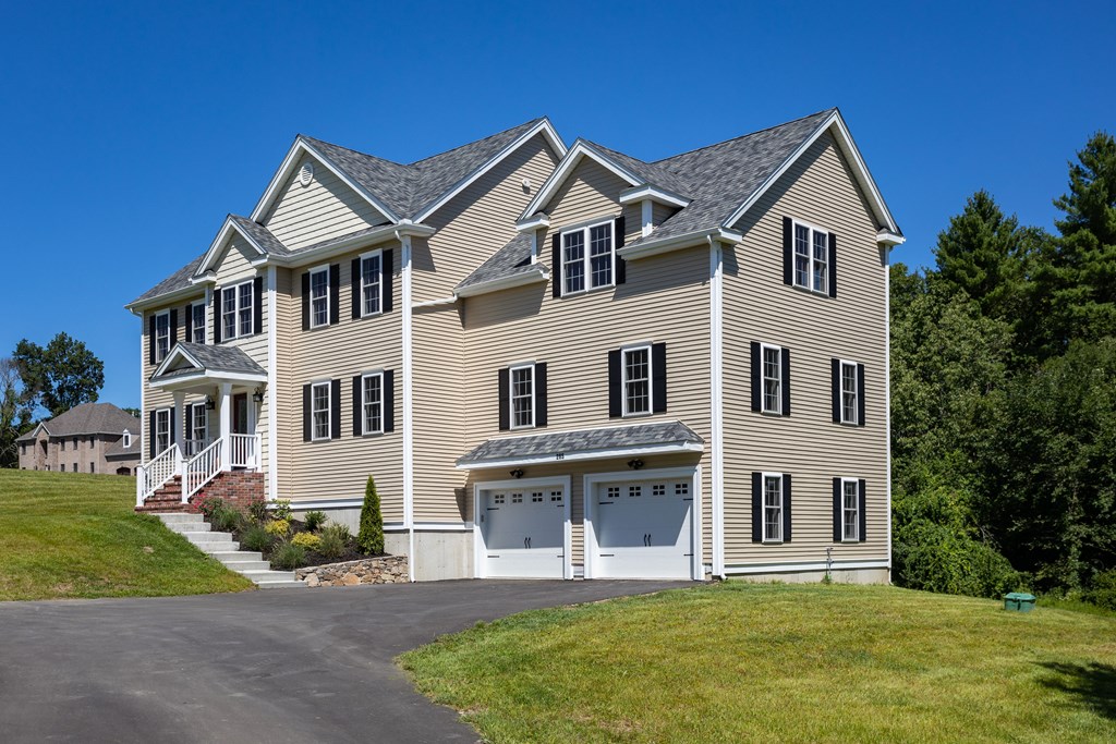 285 Putnam Hill Road Sutton, MA 01590 - Photo 3 of 6 a front view of a house with a yard